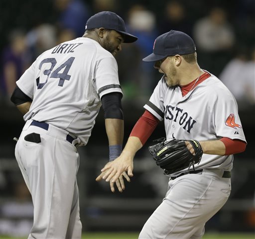Boston Red Sox closer Andrew Bailey, right, celebrates with teammate David Ortiz after defeatingthe Chicago White Sox 6-2 in a baseball game in Chicago, Wednesday, May 22, 2013. (AP Photo/Nam Y. Huh)