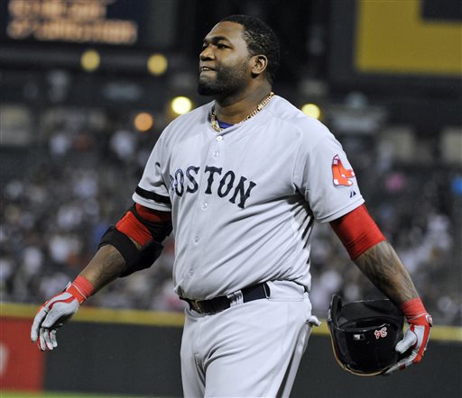 Boston Red Sox designated hitter David Ortiz reacts after hitting into a double play against the Chicago White Sox during the eighth inning of a baseball game,Tuesday, May 21, 2013 in Chicago. (AP Photo/David Banks)