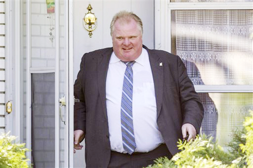 Toronto Mayor Rob Ford leaves his home on Friday after published reports said a video appears to show Ford smoking crack cocaine. A report published Thursday night said the video is being shopped around by a group of men allegedly involved in the drug trade. The Toronto Star said, however, it had no way to verify the video. Ford called the allegations ridiculous.
