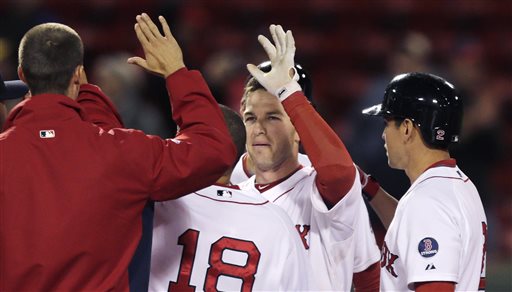Boston Red Sox shortstop Stephen Drew is congratulated by teammates after his game-winning, RBI double in the eleventh inning of a baseball game against the Minnesota Twins at Fenway Park in Boston, Monday, May 6, 2013. The Red Sox won 6-5. (AP Photo/Charles Krupa)