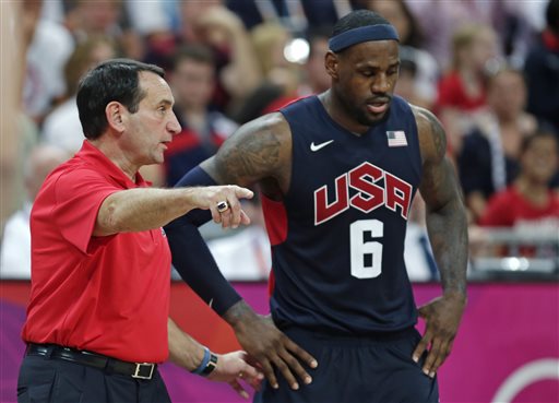In this Aug. 4, 2012, photo, U.S. coach Mike Krzyzewski talks with LeBron James during a game against Lithuania at the Summer Olympics in London.