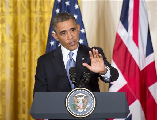 President Barack Obama gestures during a joint news conference with British Prime Minister David Cameron on Monday, in the East Room of the White House in Washington.