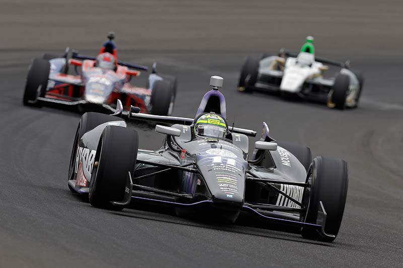 Tony Kanaan of Brazil drives through the first turn Sunday in the Indianapolis 500 on Sunday.