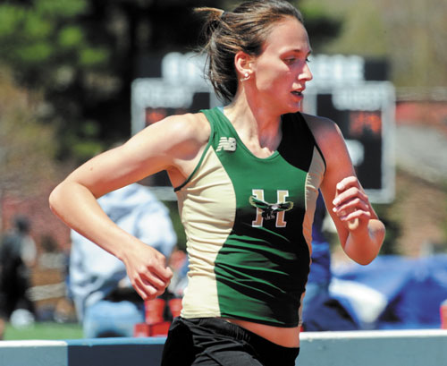 GIVING HER ALL: Husson College’s Chrissy Larrabee competes in the women’s 1,500-meter run in the New England Division III track and field championships Saturday at Colby College.