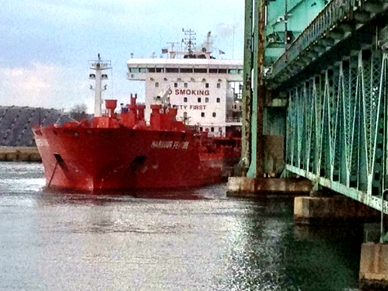 The Portuguese tanker MV Harbour Feature rests against the Sarah Mildred Long Bridge after breaking away from a pier on April 1, 2013.