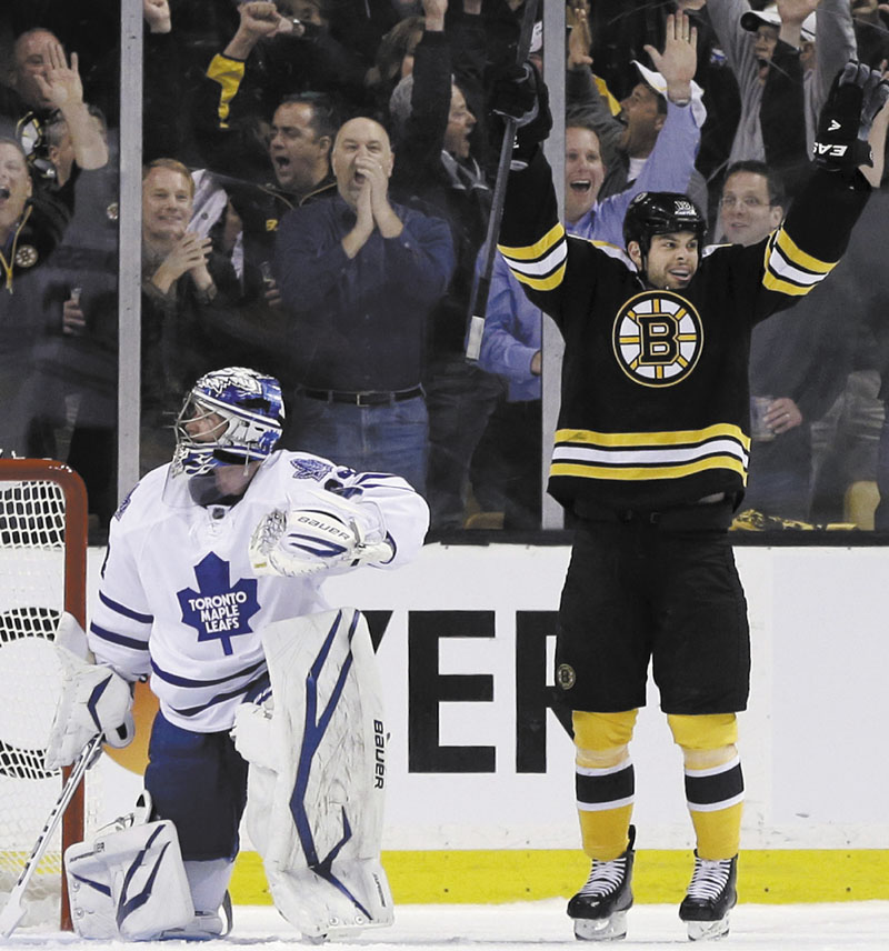 ALL RIGHT: Boston right wing Nathan Horton, right, celebrates his goal in the first period against Toronto goalie James Reimer during Game 1 of their first-round playoff series Wednesday in Boston. TD Garden