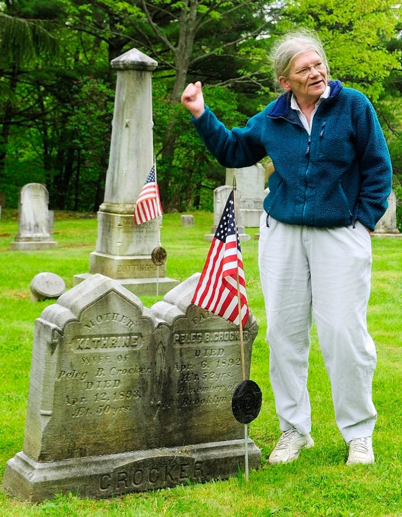 Standing beside the graves of Civil War Veteran Peleg Crocker and his wife, Katharine, Libby Doak talks about the him and many other soldiers buried nearby during an interview on Friday in Chelsea's Riverside Cemetery.