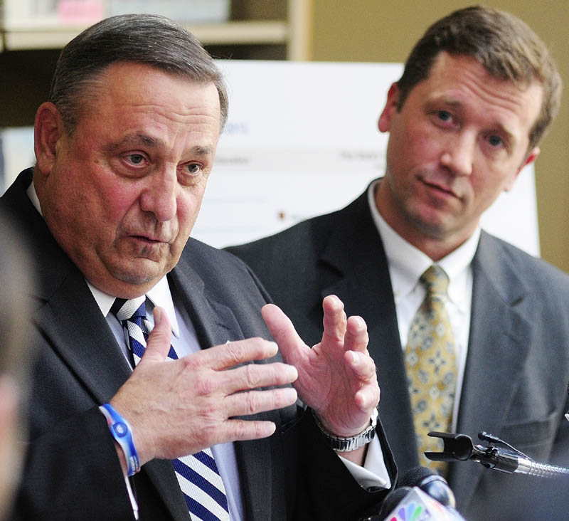 Gov. Paul LePage, left, and Education Commissioner Stephen Bowen unveiled the state's new A-F grading system on Wednesday at the Maine State Library. Gov. Paul LePage said the grades would make schools accountable.