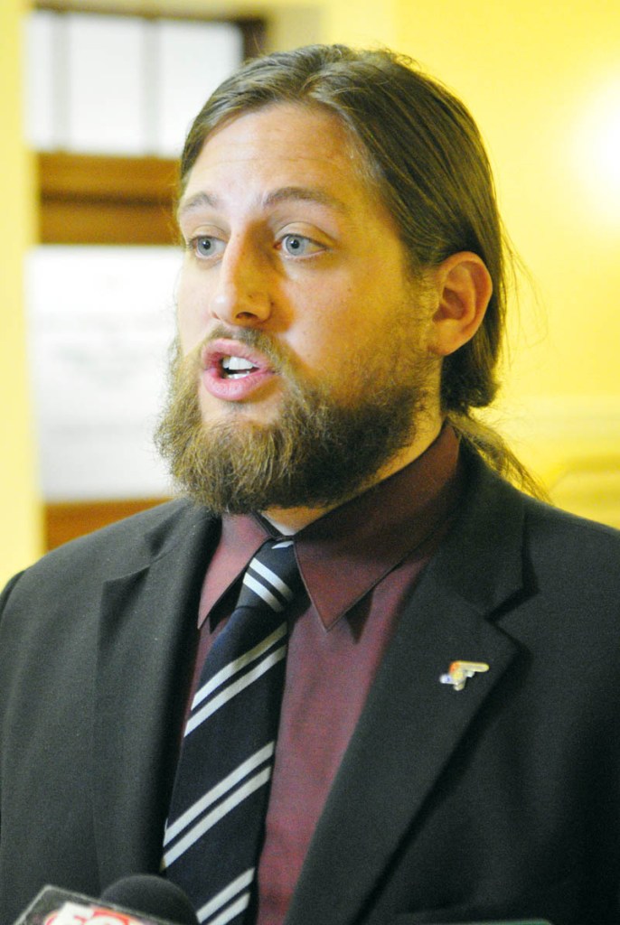 Paul T. McCarrier, legislative liaison for the Medical Marijuana Caregivers of Maine, talks to reporters on Friday at the State House in Augusta. He was there to testify against L.D. 1229, An Act To Regulate and Tax Marijuana.