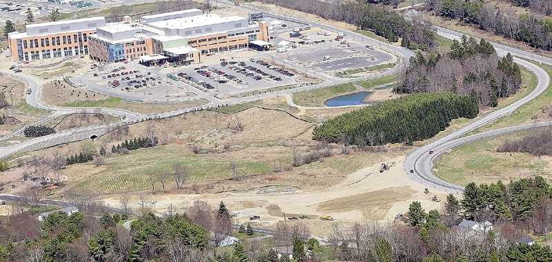 This aerial photo taken on Tuesday shows road construction between Old Belgrade Road, bottom, and exit ramps for Interstate 95 Exit 113 and the new MaineGeneral regional hospital being built in Augusta.
