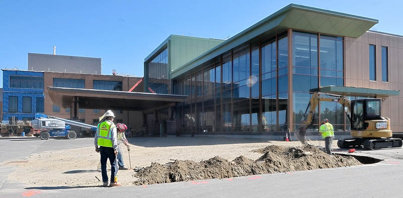 Construction workers can be seen near the entrance of the new MaineGeneral Medical Center regional hospital in Augusta last week.