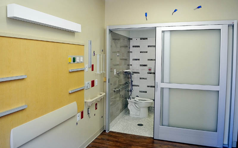 This photo, taken during a tour on Tuesday, shows that patient rooms at the new MaineGeneral regional hospital in North Augusta feature sliding doors on the bathrooms .