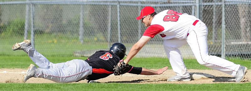 Skowhegan baserunner Kaleb Brown can't beat the pickoff throw back to first in time and gets tagged out by Cony first baseman Benjamin Lucas during a game on Friday May, 10 2013 in Augusta.