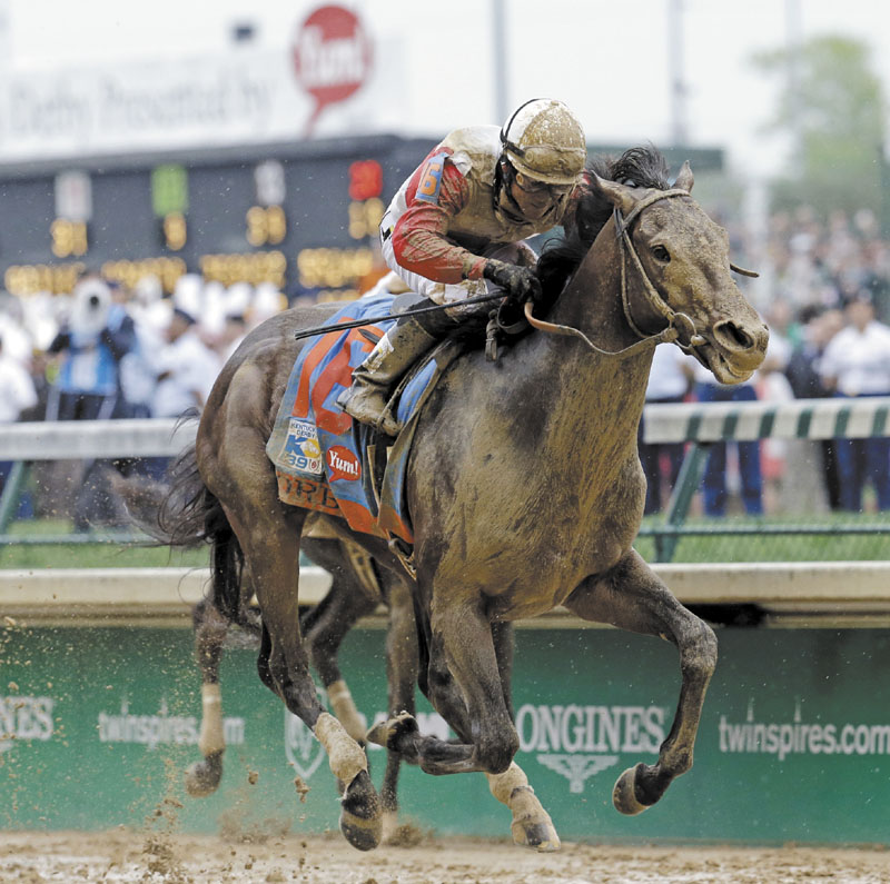MAKING THEIR MOVE: Joel Rosario rides Orb to the win Saturday at the 139th Kentucky Derby at Churchill Downs in Louisville, Ky.