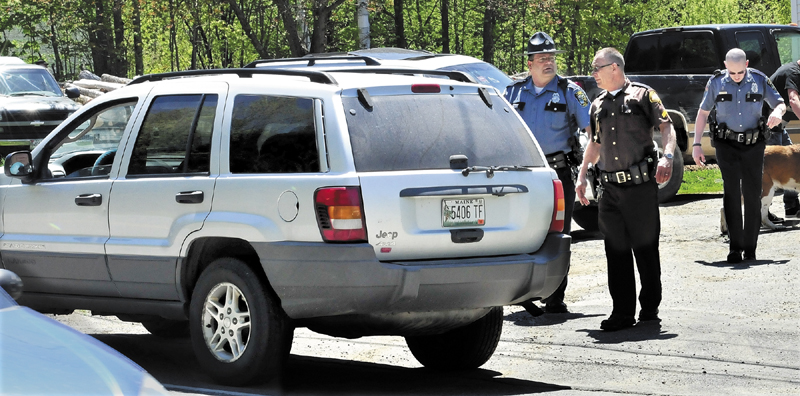 Police from several agencies converged at a residence on Middle Road in Skowhegan after Ernest Almeida of Fairfield abandoned his vehicle, foreground following a police chase where speeds exceeded 100-miles per hour on Wednesday. Police with dogs searched for him after he fled into the woods but did not apprehend him.