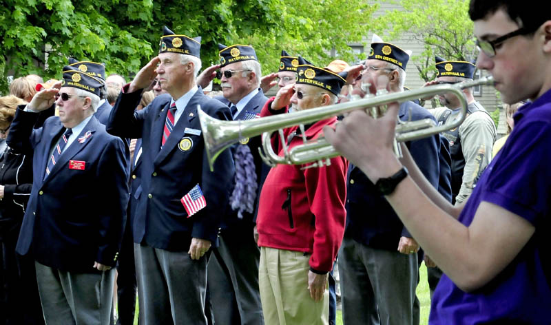 REMEMBER: Waterville American Legion Post 5 members from front left are Ernie Paradis, Gilman Pelletier and Tom Longstaff, salute during Memorial Day celebration at Veteran's Park as Liam Edwards plays Taps on Monday, May 27, 2013