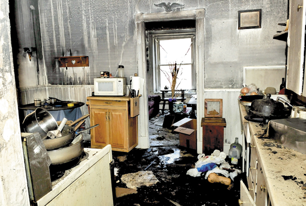 The photo shows a fire and water damaged kitchen in a second floor apartment on Monday that was destroyed by fire on Main Street in Waterville on Friday.
