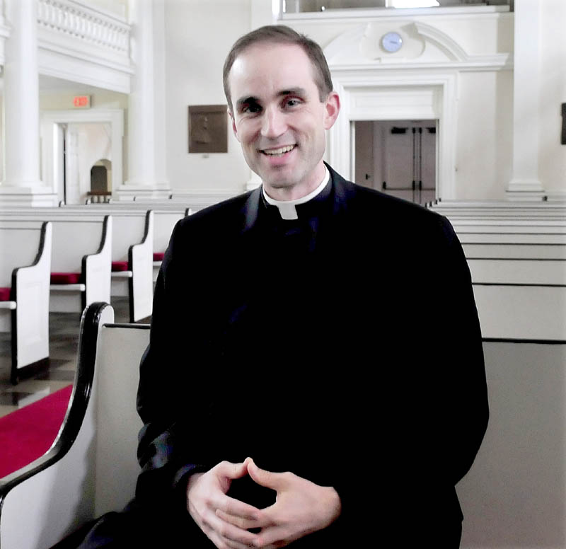 The Rev. Jack Dickinson sits in a pew in Lorimer Chapel at Colby College in Waterville on Sunday. Dickinson will be relocating to the Good Shepherd Parish in the Saco and Biddeford area, effective Aug. 1.