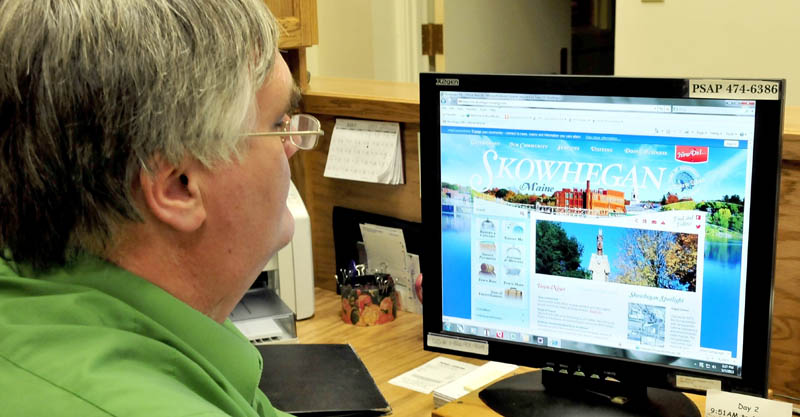 Jeff Hewett, director of Skowhegan Economic and Community Development, looks over the new interactive town website on Tuesday.