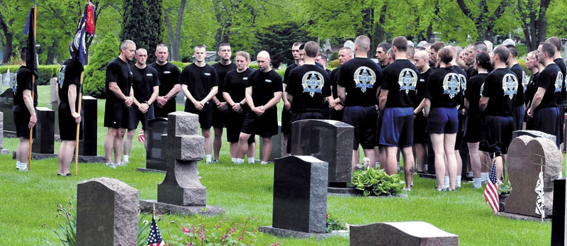 Cadets from the Maine Criminal Justice Academy ran from the Vassalboro facility to St. Francis Catholic Cemetery in Waterville on Thursday during the Fallen Law Enforcement Officers run. Once there, the 42 cadets paid tribute to Trooper Jeffrey Parola who died in 1994 while responding to a call involving firearms in Sidney.