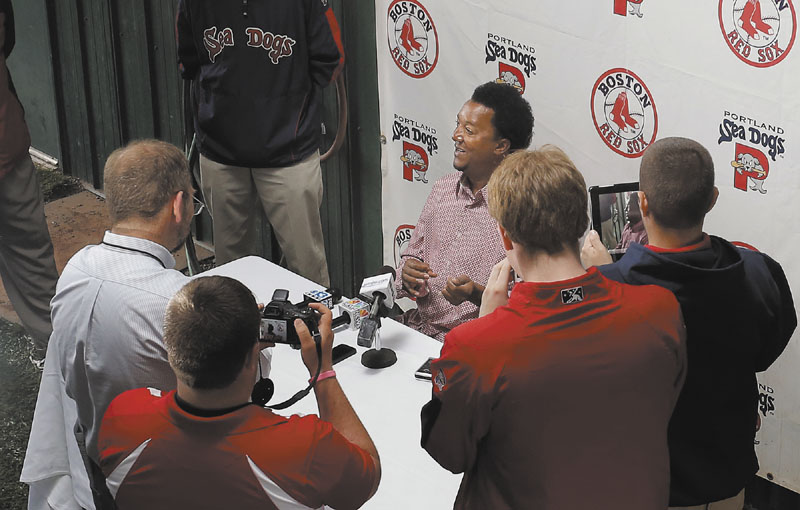 STAR IN TOWN: Former Red Sox pitcher Pedro Martinez, now special assistant to the general manager, fields questions at a press conference Wednesday at Hadlock Field in Portland. Martinez was in town to work with the Sea Dogs’ pitching staff.