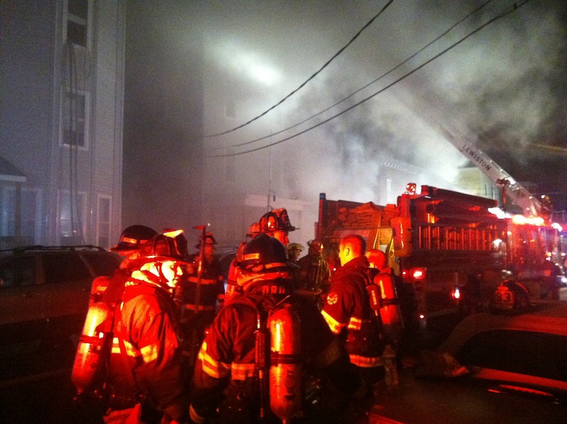 Firefighters battle a multi-structure blaze in downtown Lewiston in the early hours of Saturday morning.