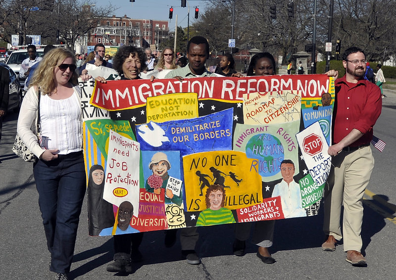 A variety of groups in Portland marched in support of immigration reform from Lincoln Park to Monument Square on Wednesday, May 01, 2013. This banner was made by the Artist Rapid Response Team!, part of the Union of Maine Visual Artists who regulary paint banners for groups whose mission they support.