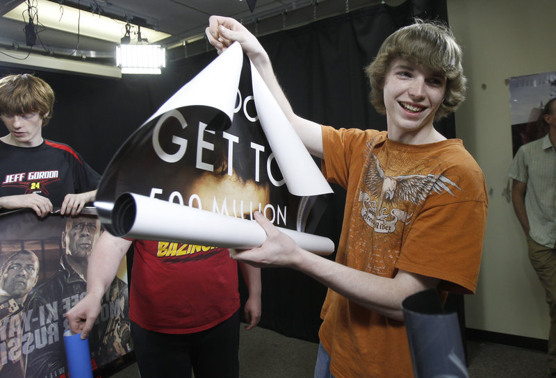 In this Thursday, May 16, 2013 photo, A.J. Swan holds a movie poster during class in Randolph, Vt. Failing 9th grade for the second year in row, Swan said he had accepted that he wasn’t going to graduate from high school. That was until the school stepped in and offered him some alternative ways to prove his competencies and a hands-on learning environment at a technical school where he has thrived in video. (AP Photo/Toby Talbot)
