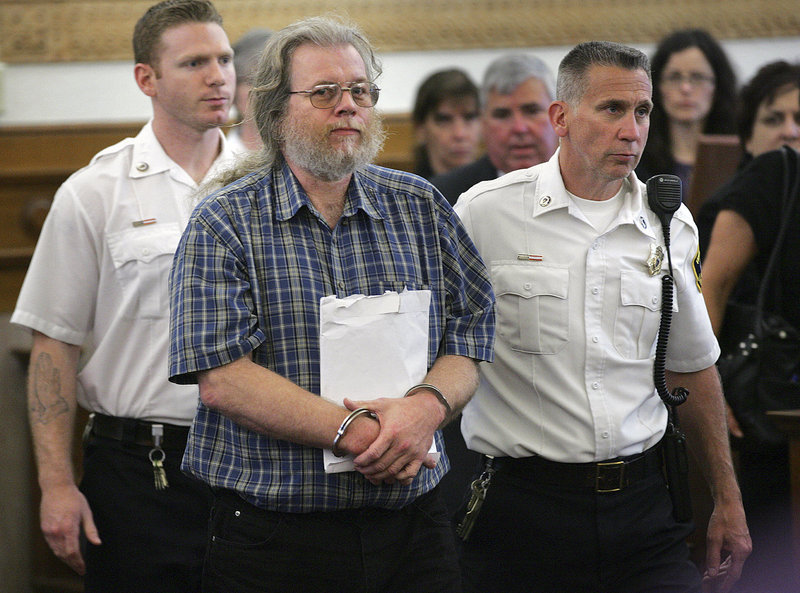 Convicted rapist Gary Irving is led into Norfolk Superior Court in Dedham, Mass., Thursday, May 23, for sentencing. Irving was sentenced to 36 to 40 years in prison for raping three women in Massachusetts, more than three decades after he fled the state and began living a secret life in Maine. (AP Photo/The Patriot Ledger, Gary Higgins, Pool)