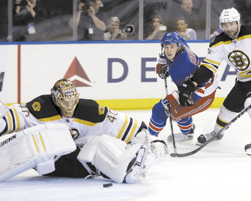 WHOOPS: New York ’s Carl Hagelin, center, watches as his shot gets past Boston goalie Tuukka Rask during the second period of the Rangers’ 4-3 win in Game 4 of the Eastern Conference semifinals Thursday in New York.