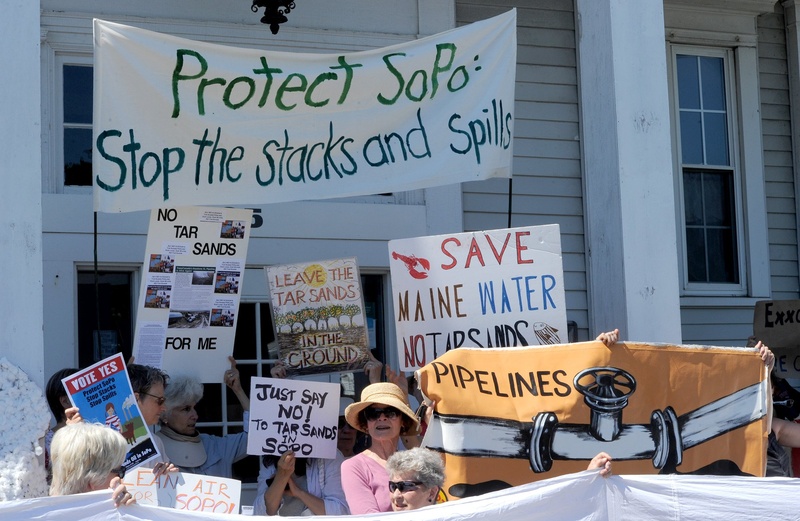 Members and supporters of Concerned Citizens of South Portland hold a news conference outside South Portland City Hall on Monday. TarSands
