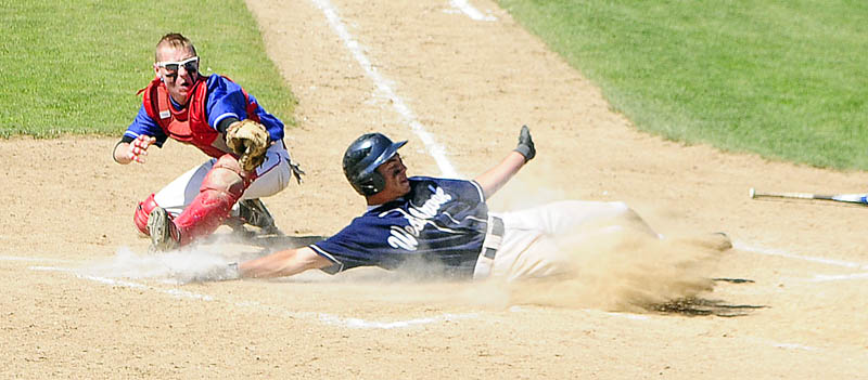 Westbrook's Kaleb Kent scores the Blue Blazes second run by beating throw to Messalonskee catcher Trevor Gettig during Class A baseball state championship game Saturday at Morton Field in Augusta.