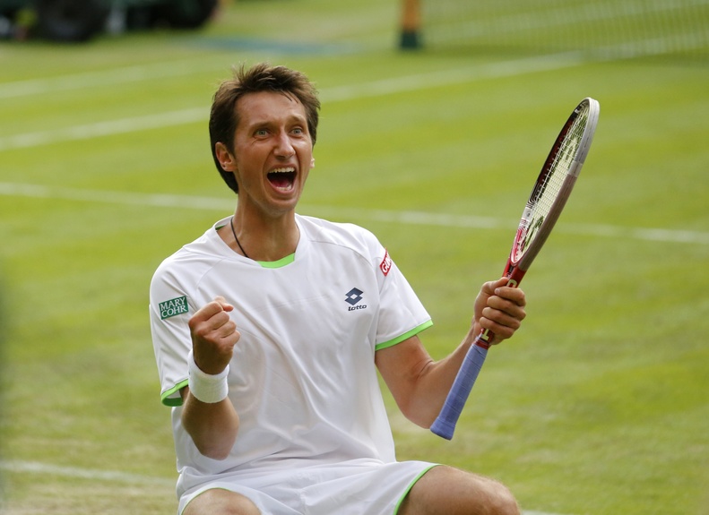 Sergiy Stakhovsky of Ukraine reacts as he wins against Roger Federer of Switzerland in their men's second-round singles match at Wimbledon in London on Wednesday.