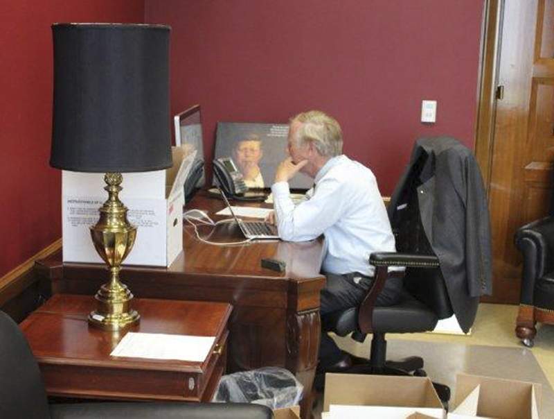 Sen. Angus King, I-Maine, is surrounded surrounded by boxes Tuesday as he sits at his desk in his new, permanent office in the Dirksen Senate Office Building in Washington, D.C. The same desk has been used by a lineage of Maine senators, including King’s predecessor Sen. Olympia Snowe, Sen. George Mitchell and Sen. Edmund Muskie.