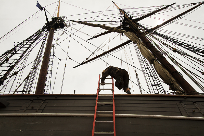A crew member climbs aboard the replica of the former slave ship Amistad on Thursday, which is in dry dock at Gowen Marine in Portland.