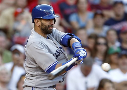 Toronto Blue Jays outfielder Jose Bautista hits an RBI double in the ninth inning Saturday against the Boston Red Sox at Fenway Park in Boston. Bautista smacked two home runs in the game. The Blue Jays won 6-2.