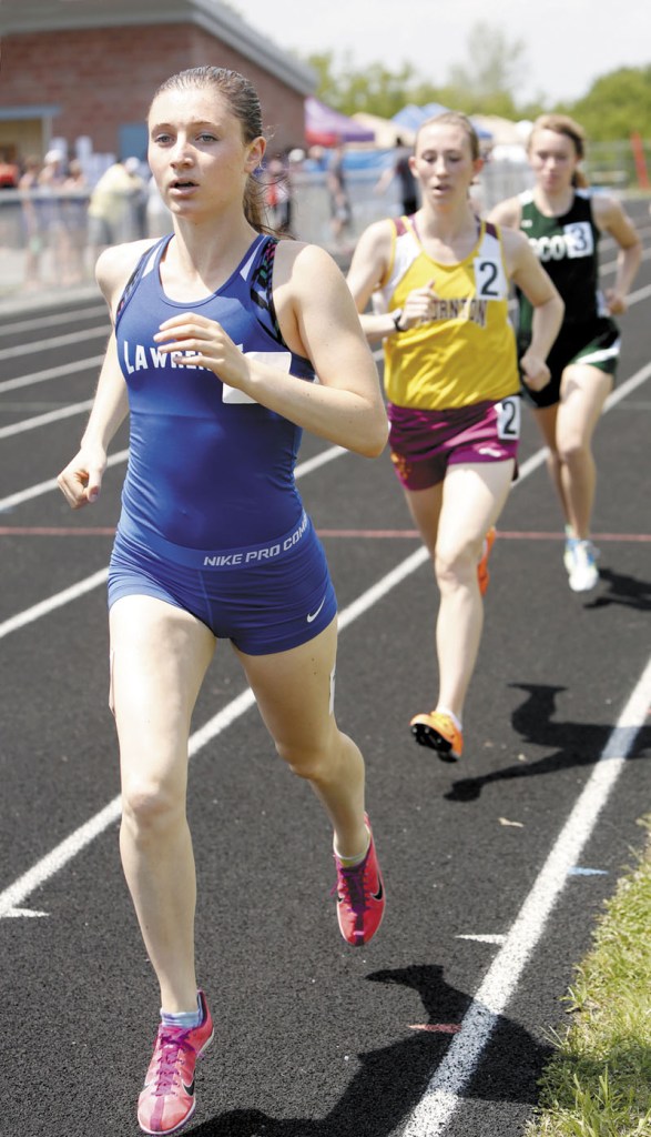 ON THE WAY TO VICTORY: Lawrence High School’s Erzsie Nagy makes her way to the finish line in the 1,600-meter run at the Class A state championships track and field meet Saturday in Brewer. Nagy won the race in a time of 5 minutes, 1.07 seconds. She also won the 800 and the 3,200 to help the Bulldogs finish fourth.