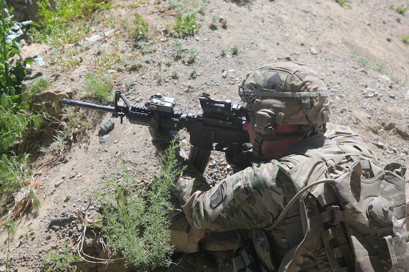 U.S. Army Sgt. Corey Garver, with Baker Company, 1st Battalion, 506th Infantry Regiment, 4th Brigade Combat Team, 101st Airborne Division, provides security as Afghan and American soldiers clear a village in Paktia province, Afghanistan, May 29, 2013. Garver was killed Sunday in Afghanistan. (U.S. Army photo by Spc. Robert Porter/Released) 3-187 infantry 2-29 SFAAT 28