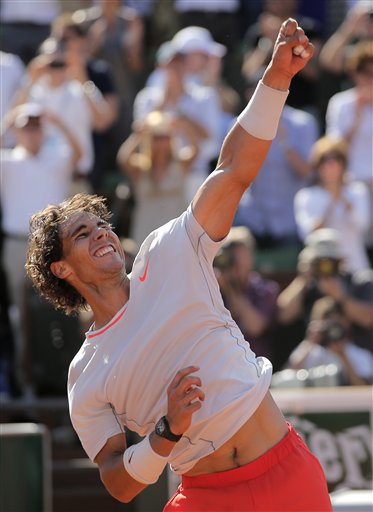 Spain's Rafael Nadal reacts after defeating Serbia's Novak Djokovic during their semifinal match of the French Open tennis tournament at the Roland Garros stadium Friday in Paris.