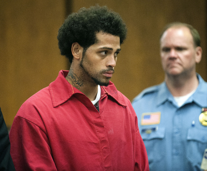 Carlos Ortiz is shown during a hearing in court in Bristol, Conn., on Friday. He was turned over to Massachusetts authorities and pleaded not guilty to firearms charges there later in the day.