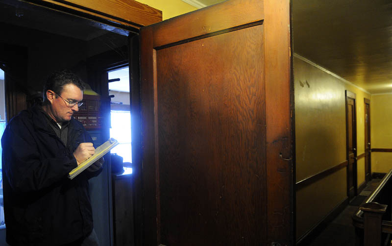 City of Augusta Code Enforcement Officer Robert Overton inspects an apartment in the city on Tuesday.