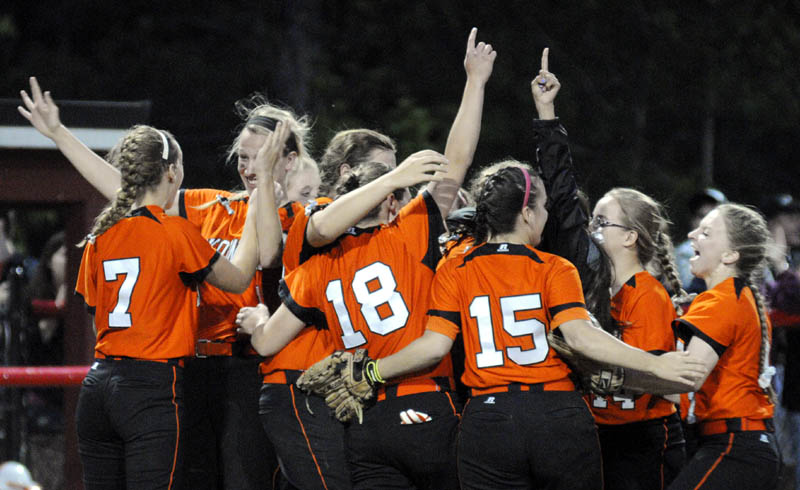 WE DID IT: The Skowhegan softball celebrates at the mound after winning the Eastern A title with a 2-0 win over Bangor on Thursday at Cony High School in Augusta.