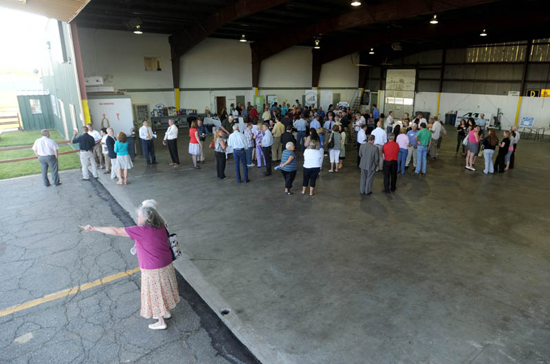 Mid-Maine Chamber of Commerce members gather in the hanger at the newly renovated Robert LaFleur Municipal Airport in Waterville for a Business After Hours event on Wednesday.