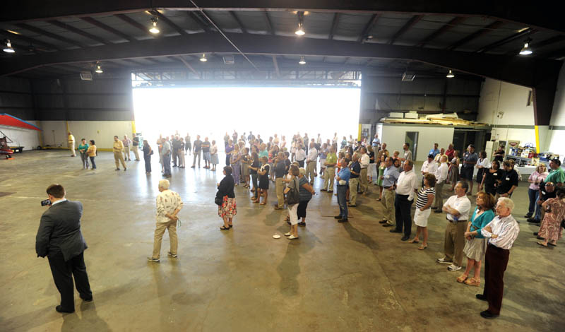 Mid-Maine Chamber of Commerce members gather in the hanger at the newly renovated Robert LaFleur Municipal Airport in Waterville for a Business After Hours event on Wednesday.