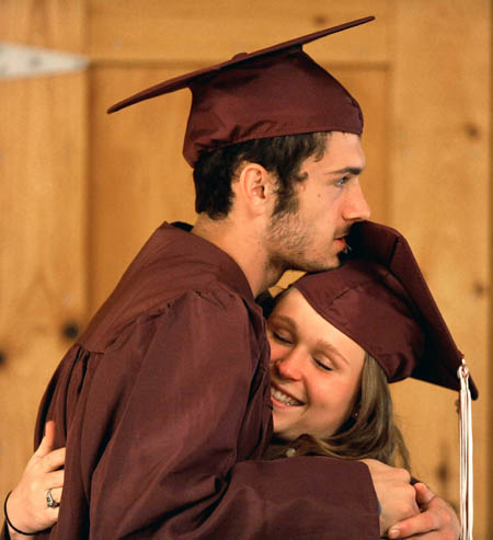 Josh Wheeler and Priscilla Chambers share a hug in the cafeteria at Nokomis High School prior to commencement ceremonies in Newport on Friday.
