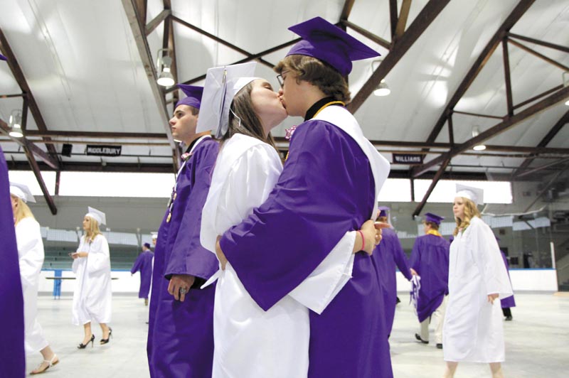 Waterville Senior High School seniors Brianna Benevento and Evan Matteson share an embrace before graduation Thursday night. The couple said they have been dating for several years.