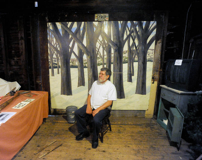 John Verrier, 63, a History House volunteer, takes a break in the barn of the Cotton-Smith House on High Street in Fairfield during the Fairfield Days Community Festival on Saturday.