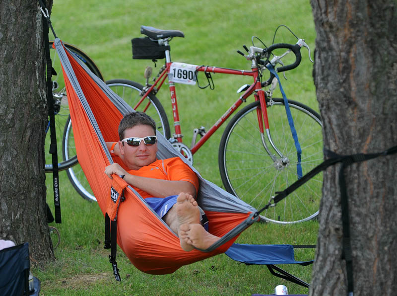 Adam Brandow, of Standish, relaxes in his hammock at Colby College in Waterville after finishing the second leg of the American Lung Association Trek Across Maine.