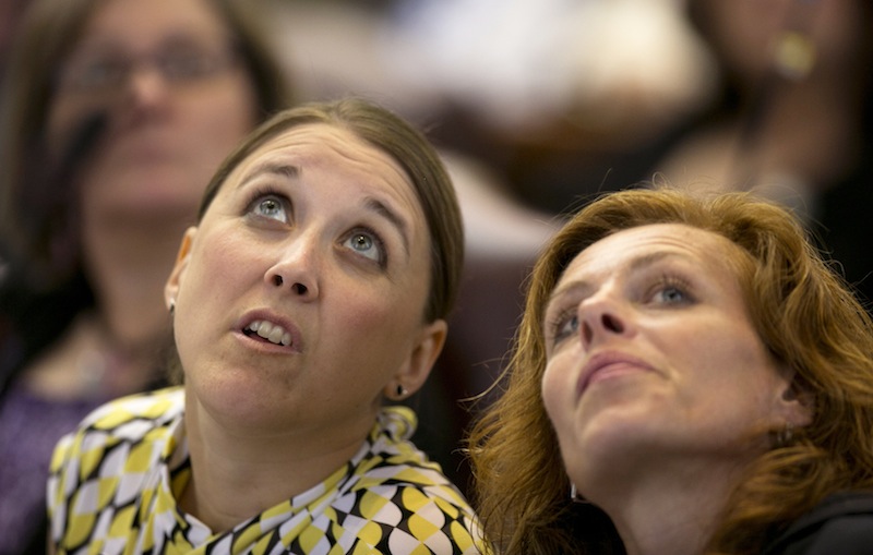 State Reps. Eleanor Espling, R-New Gloucester, left, and Amy Volk, R-Scarborough, look at the tote board during a roll call vote on the state budget during a session Thursday, June 13, 2013, at the State House in Augusta, Maine. Lawmakers are taking up a budget proposal that earned unanimous committee approval and a veto threat from Gov. Paul LePage. (AP Photo/Robert F. Bukaty)
