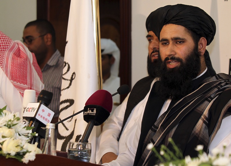 Muhammad Naeem a representative of the Taliban speaks during a press conference at the official opening of their office in Doha, Qatar, Tuesday, June 18, 2013. In a major breakthrough, the Taliban and the U.S. announced Tuesday that they will hold talks on finding a political solution to ending nearly 12 years of war in Afghanistan as the Islamic militant movement opened an office in Qatar. American officials with the Obama administration said the office in the Qatari capital of Doha was the first step toward the ultimate U.S.-Afghan goal of a full Taliban renouncement of links with al-Qaida. (AP Photo/Osama Faisal)